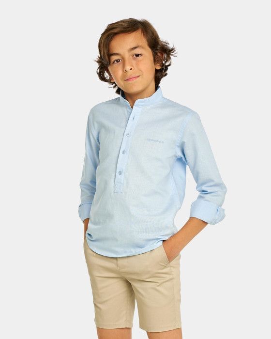 Camisa polo azul de Spagnolo para niño, elegante y cómoda.